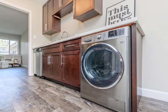 a stove top oven sitting inside of a kitchen