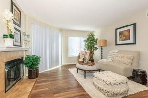 a living room filled with furniture and a flat screen tv