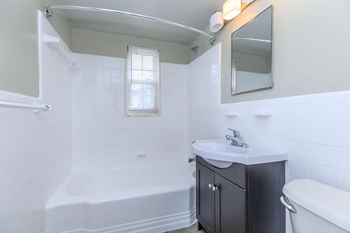 a room with a sink and a mirror