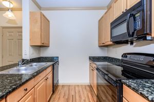 a kitchen with a stove and a sink