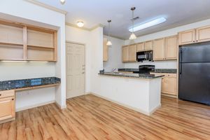 a kitchen with a wood floor