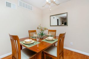 COMFORTABLE DINING ROOM WITH CEILING FANS