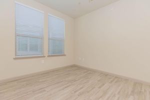 a bedroom with a large window