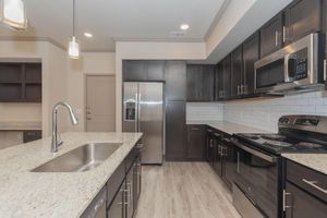 a modern kitchen with stainless steel appliances