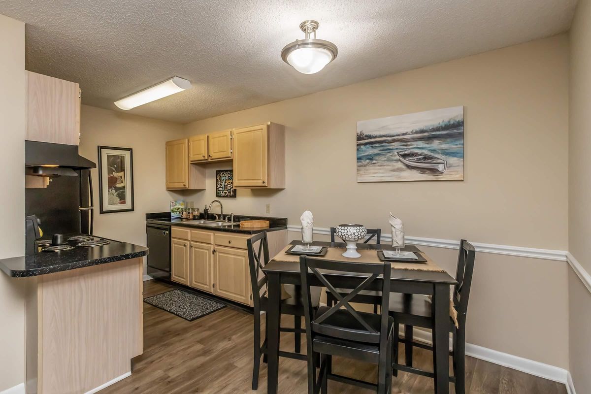 a kitchen with a dining room table