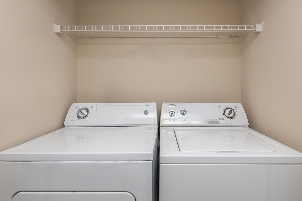 a stove top oven sitting next to a sink