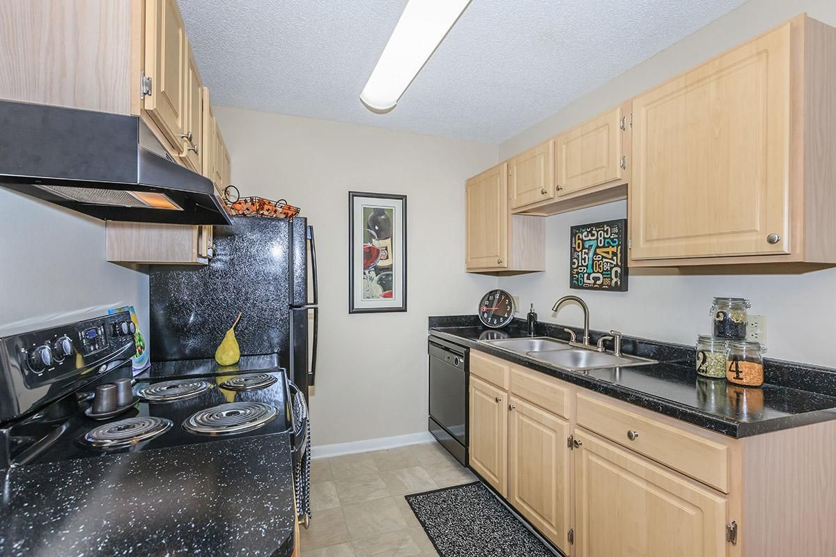 a large kitchen with stainless steel appliances