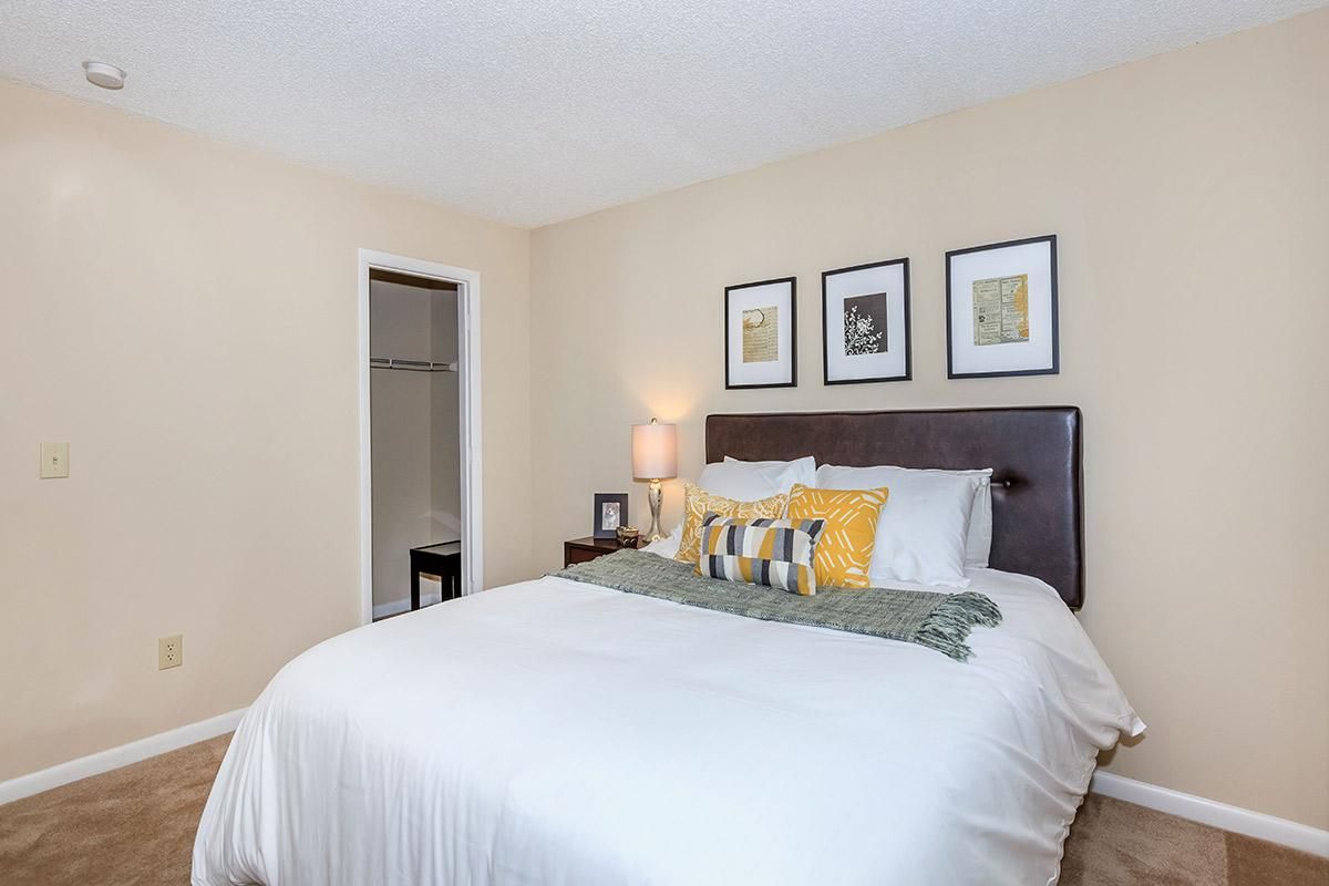 a bedroom with a large bed in a hotel room