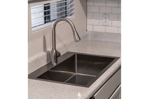 a stove top oven sitting inside of a kitchen