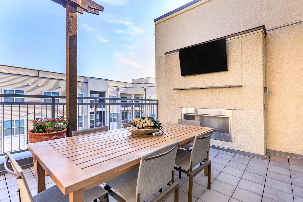 Rooftop Lounge with Fireplace & Outdoor Dining Area