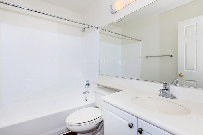 Bathroom with white cabinets