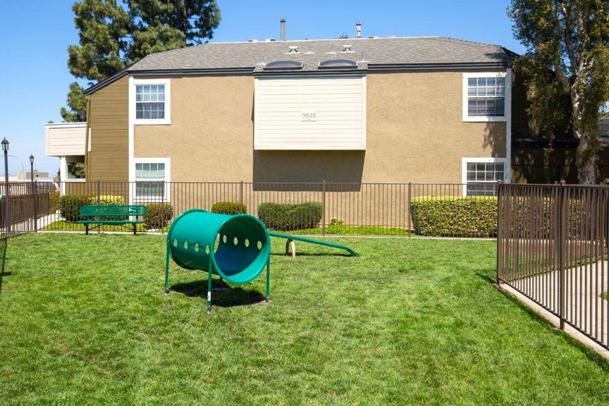 a green lawn in front of a house