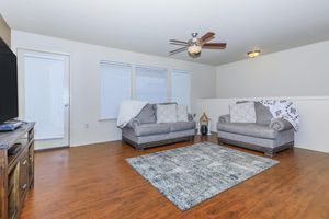 a living room with a wood floor