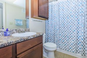 a glass shower door next to a sink