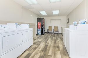 a kitchen with a sink and a refrigerator