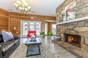 a living room filled with furniture and a fire place