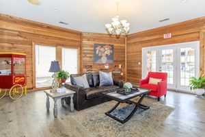 a living room filled with furniture and a fire place