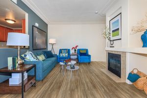 a living room filled with furniture and a tv