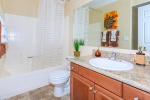 a kitchen with a sink and a mirror