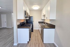 a kitchen with a wooden floor