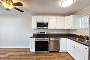 a kitchen with a stove and a microwave