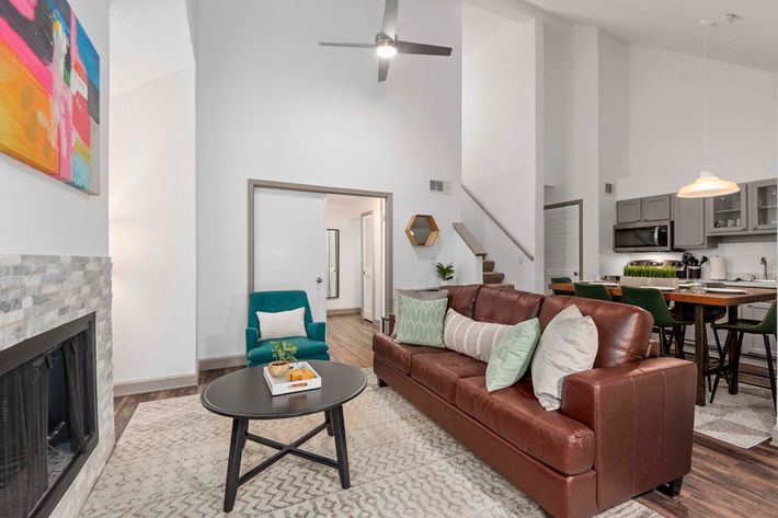 a living room filled with furniture and a tv