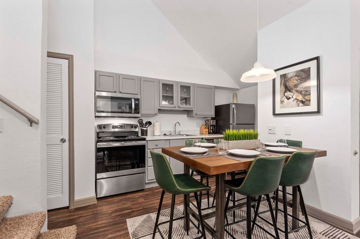 a kitchen with a table in a room