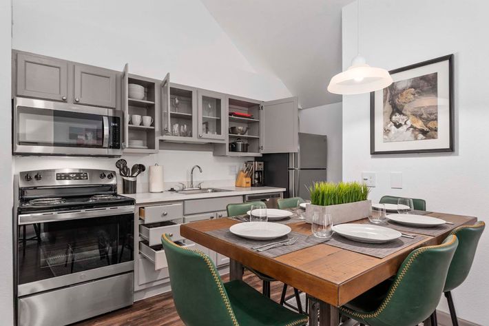 a kitchen with a table in a room