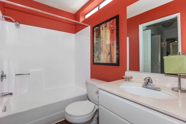 a large white tub sitting next to a sink