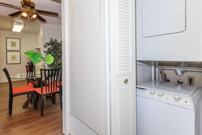 a white refrigerator freezer sitting inside of a kitchen