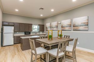 a kitchen with a table in a room