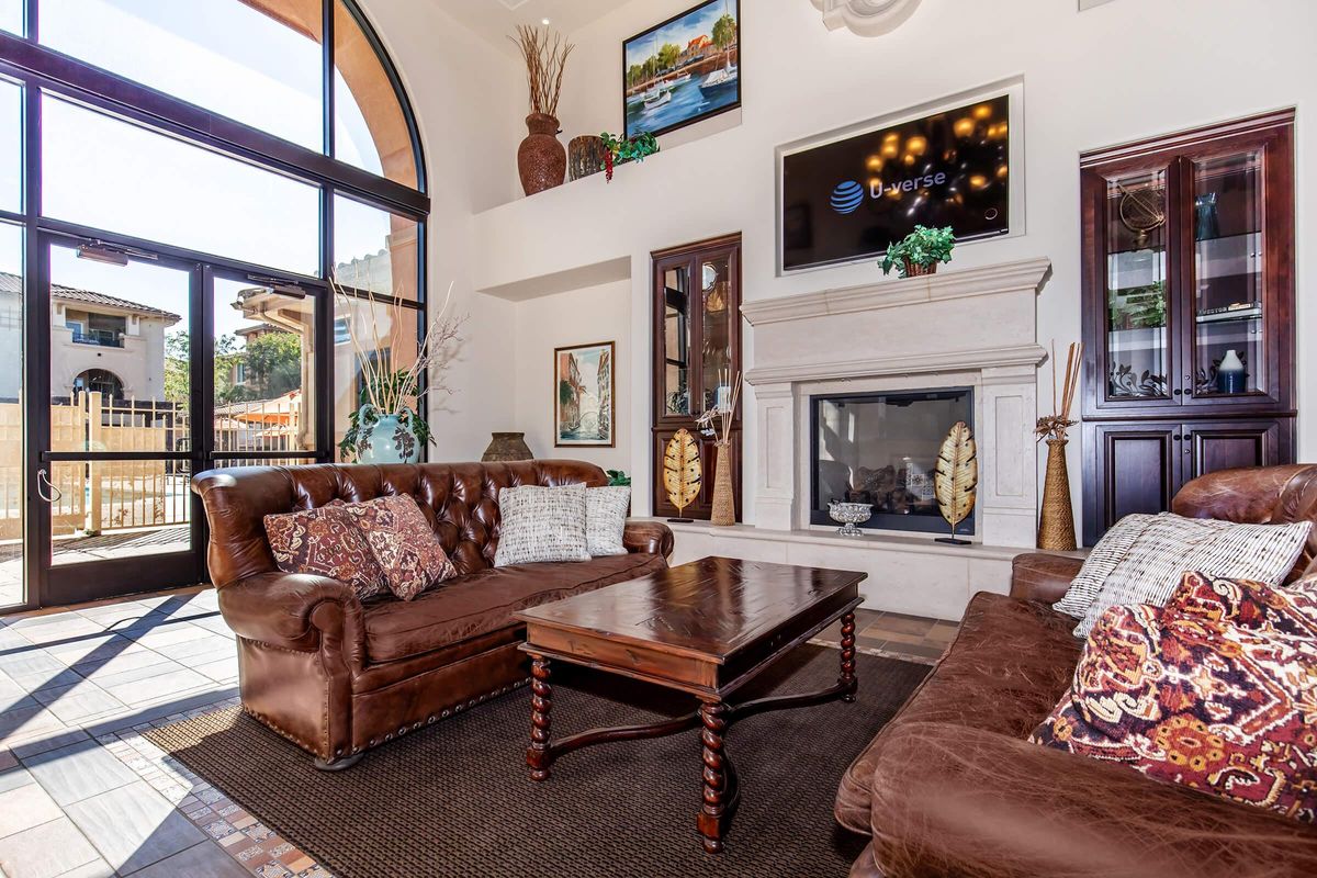 a living room filled with furniture and a fire place