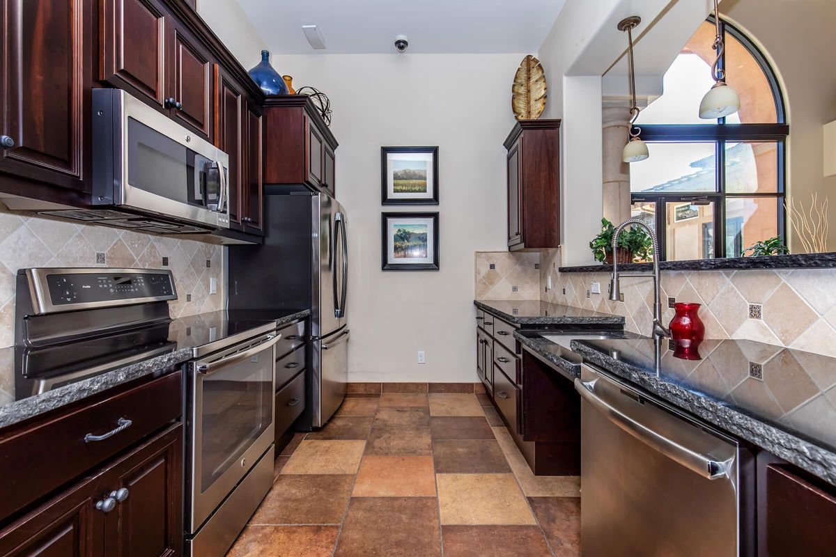 a kitchen with a stove top oven