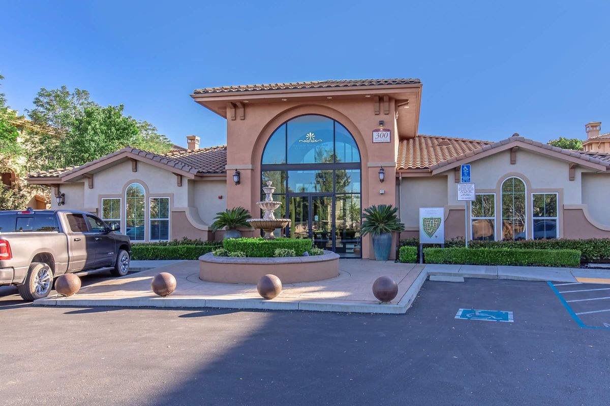 a small house in a parking lot with Paramount Pictures in the background