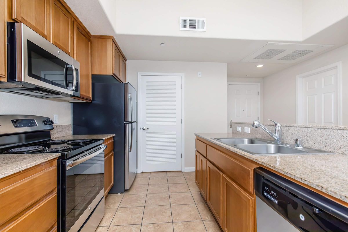 a kitchen with a stove top oven