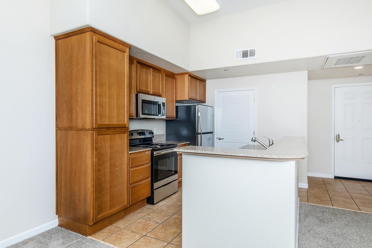 a kitchen with a stove and a refrigerator