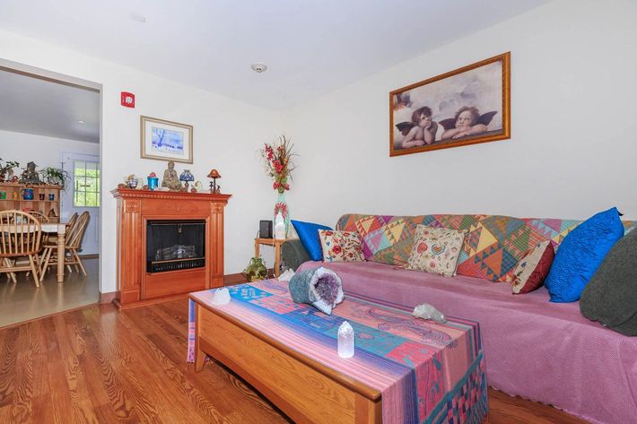 a living room filled with furniture and a flat screen tv