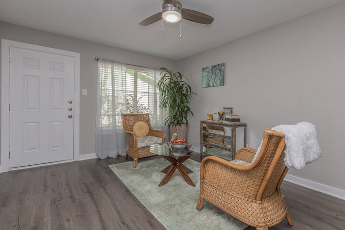 a living room filled with furniture and a rug