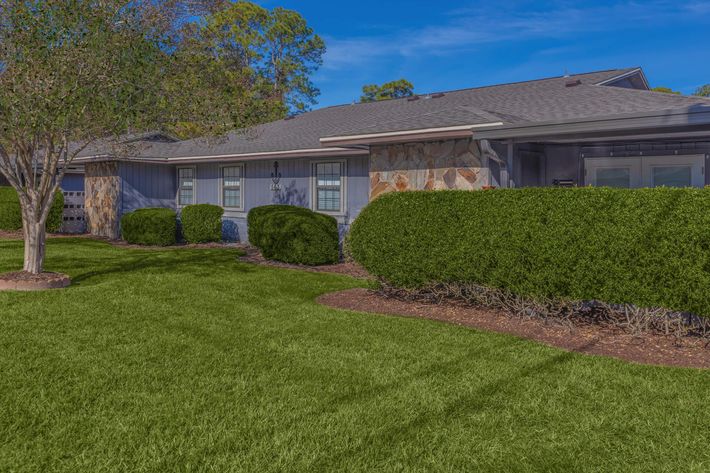 a large lawn in front of a house