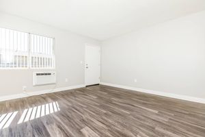 living room with an AC unit