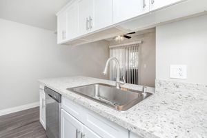 kitchen with white granite countertops