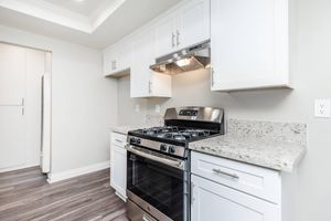 kitchen stove with white cabinets