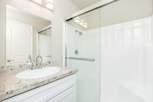 bathroom with sliding glass shower doors