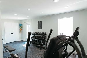 a room filled with furniture and a motorcycle