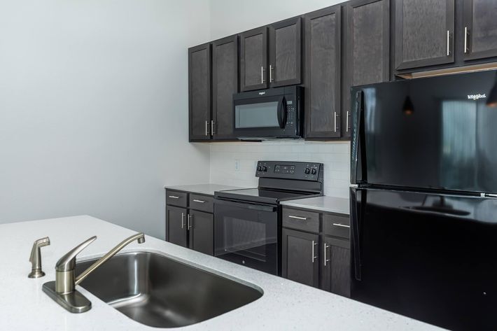 a modern kitchen with stainless steel appliances