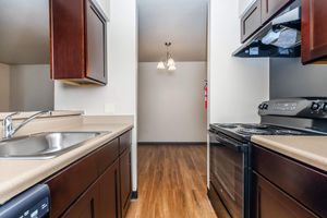 a kitchen with a sink and a mirror