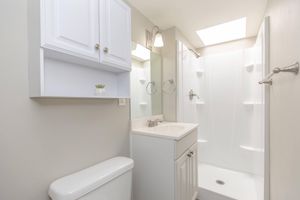 Bathroom with white cabinets