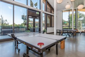 a room filled with furniture and a large window