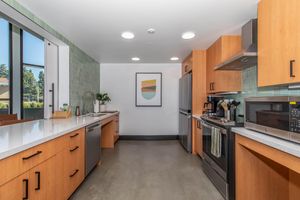 a large kitchen with stainless steel appliances