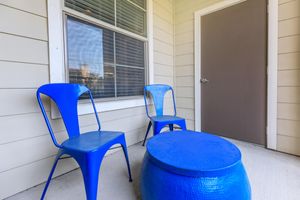 a glass with a blue chair